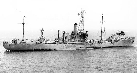 USS Liberty (AGTR-5) receives assistance from units of the Sixth Fleet, after she was attacked and seriously damaged by Israeli forces off the Sinai Peninsula on June 8, 1967. (US Navy photo)