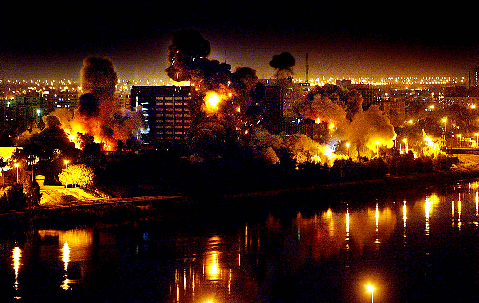 On the second night of war against Iraq, bombs fall on government buildings located in the heart of Baghdad along the Tigris River. Multiple bombs left several buildings in flames and others completely destroyed.